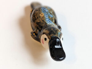 porcelain platypus figurine chopstick rest brush holder