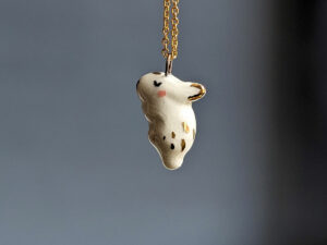 handmade porcelain pendant sleepy bunny with gold by kness