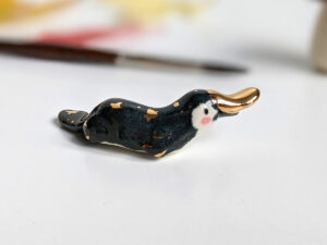 porcelain platypus figurine chopstick rest brush holder