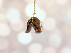 adorable porcelain otter pendant