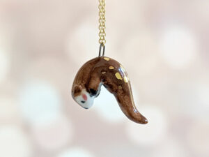 adorable porcelain otter pendant