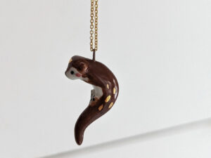 adorable porcelain otter pendant