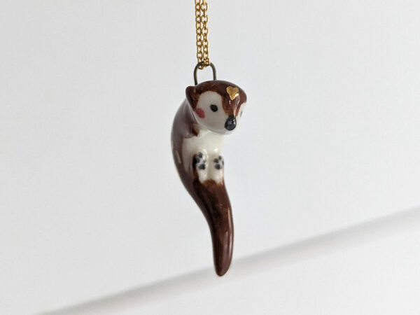 adorable porcelain otter pendant