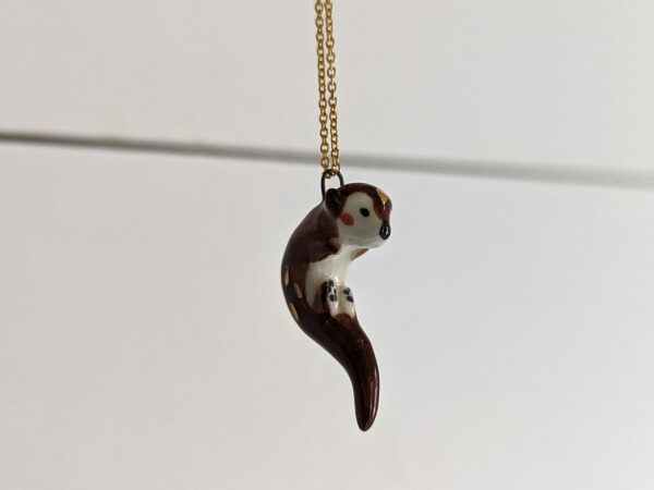 adorable porcelain otter pendant