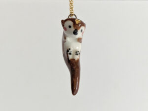 adorable porcelain otter pendant