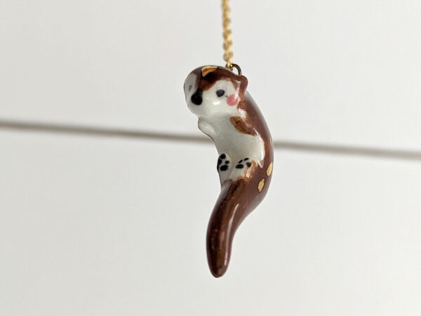 adorable porcelain otter pendant