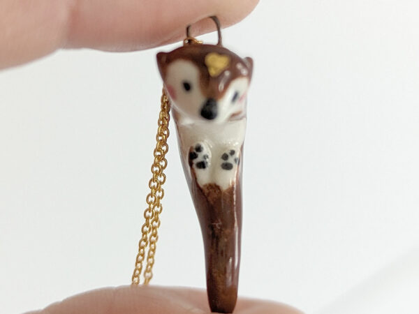 adorable porcelain otter pendant