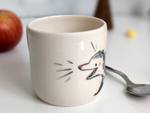 white porcelain opossum tumbler