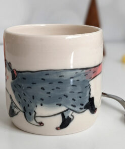 white porcelain opossum tumbler