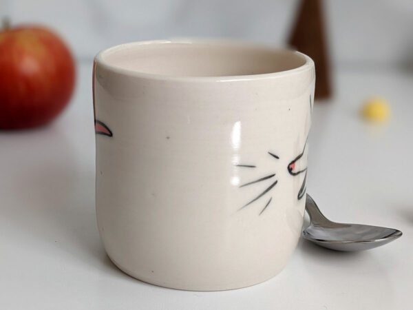 white porcelain opossum tumbler