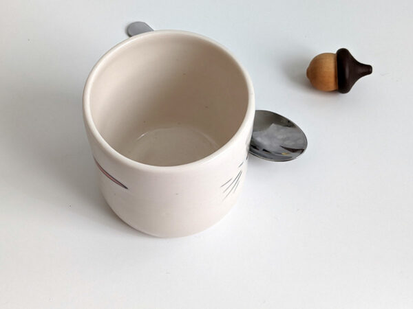 white porcelain opossum tumbler