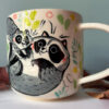 cute raccoon family mug