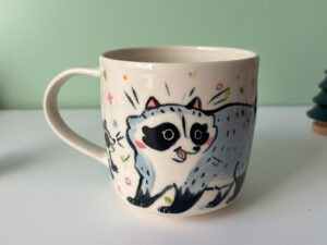cute mug handmade pottery by kness raccoon family