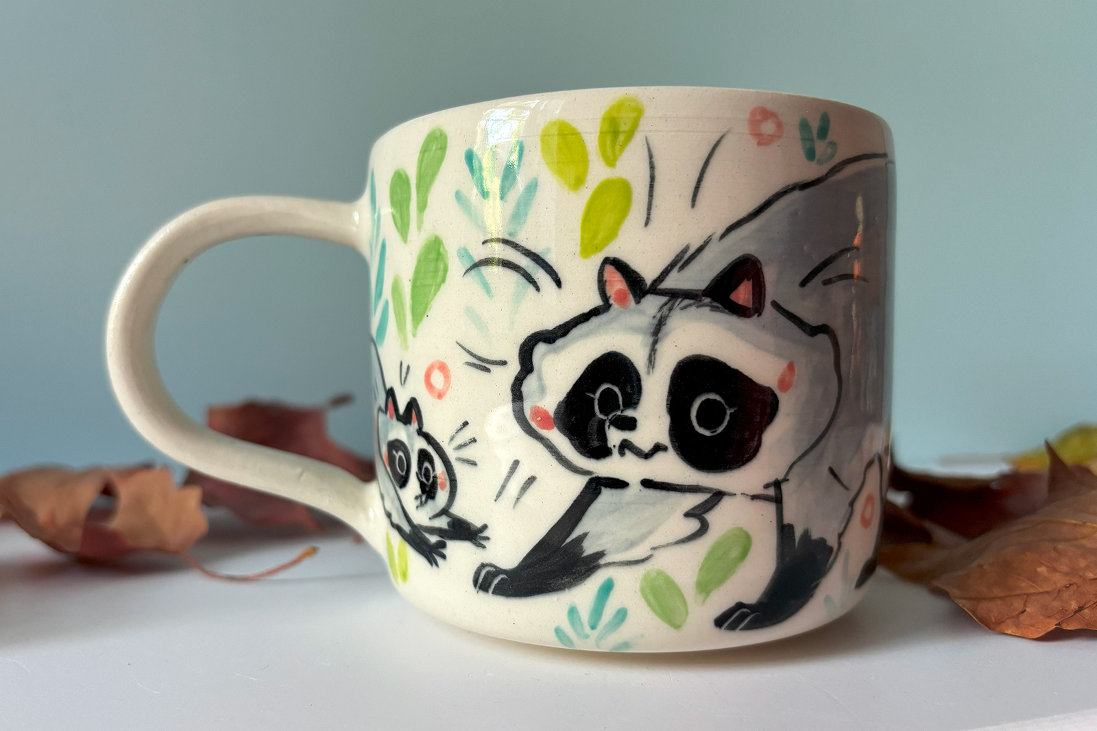 mug raccoon family