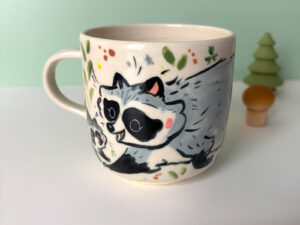 mug raccoon family
