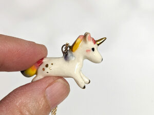 adorable porcelain pendant unicorn with rainbow mane and tail, gold, handmade, one of a kind by kness