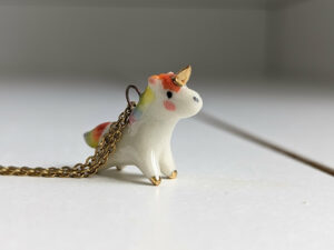 adorable porcelain pendant unicorn with rainbow mane and tail, gold, handmade, one of a kind by kness