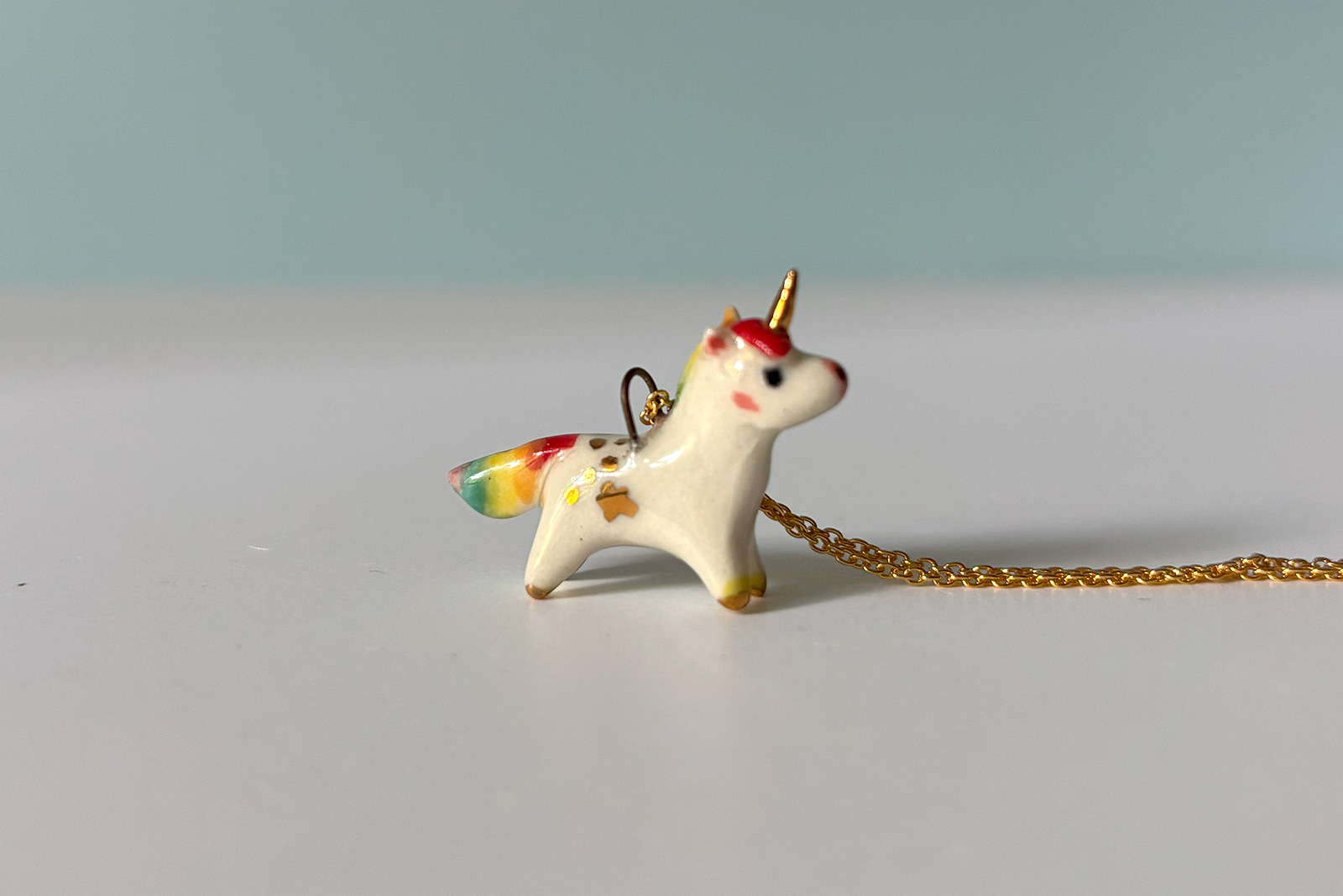 adorable porcelain pendant unicorn with rainbow mane and tail, gold, handmade, one of a kind by kness