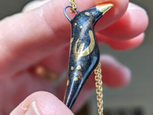 porcelain pendant crow gold