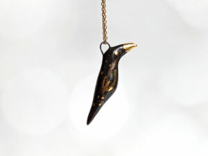 porcelain pendant crow gold