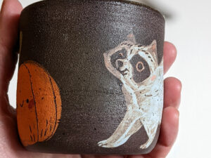 raccoon cup black clay