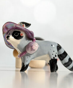raccoon witch porcelain figurine