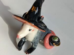 opossum witch figurine