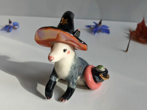 opossum witch figurine