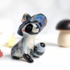 raccoon witch porcelain figurine