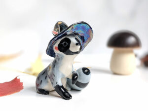 raccoon witch porcelain figurine