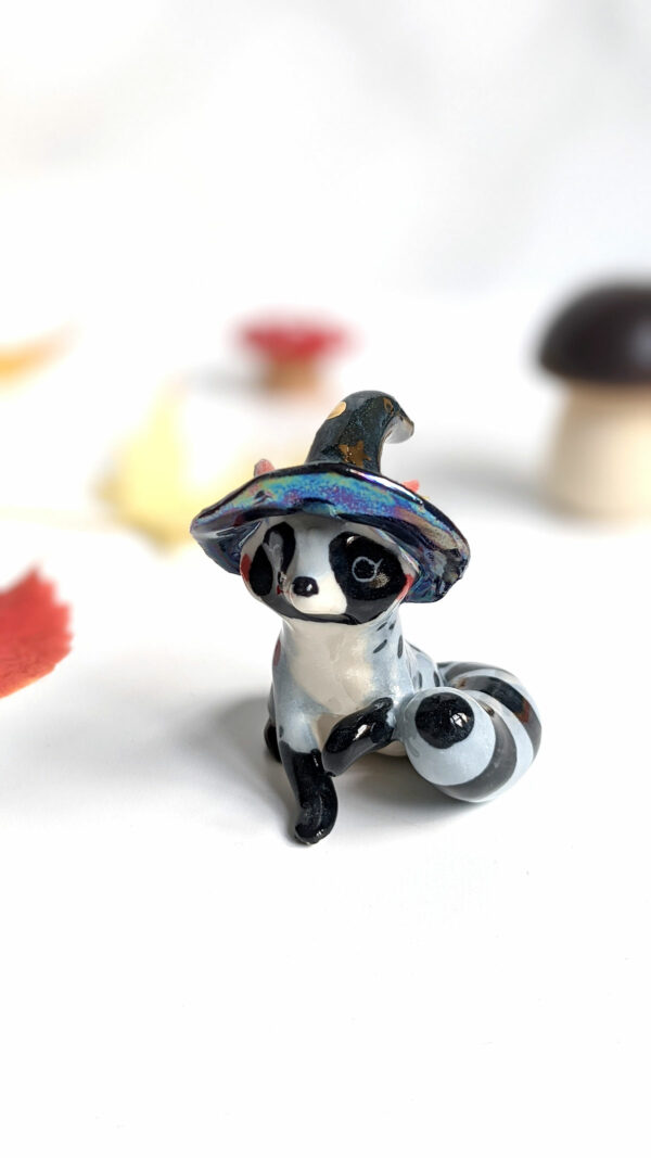 raccoon witch porcelain figurine