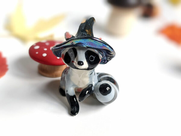 raccoon witch porcelain figurine