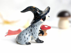 raccoon witch porcelain figurine
