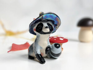 raccoon witch porcelain figurine