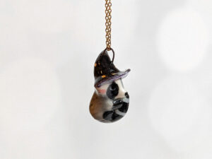 porcelain pendant witch hat raccoon