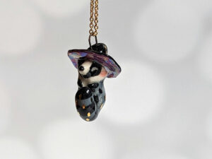 porcelain pendant witch hat raccoon