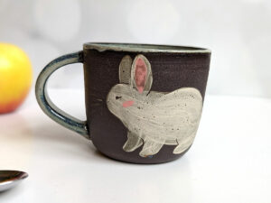 white bunnies black mug ceramic