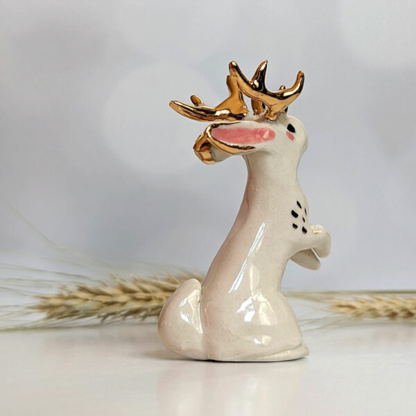 jackalope figurine with golden antlers