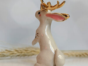 jackalope figurine with golden antlers