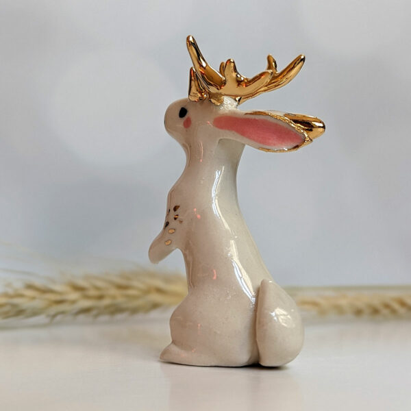 jackalope figurine with golden antlers