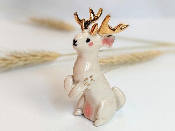 jackalope figurine with golden antlers