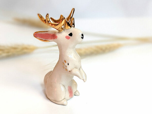 jackalope figurine with golden antlers