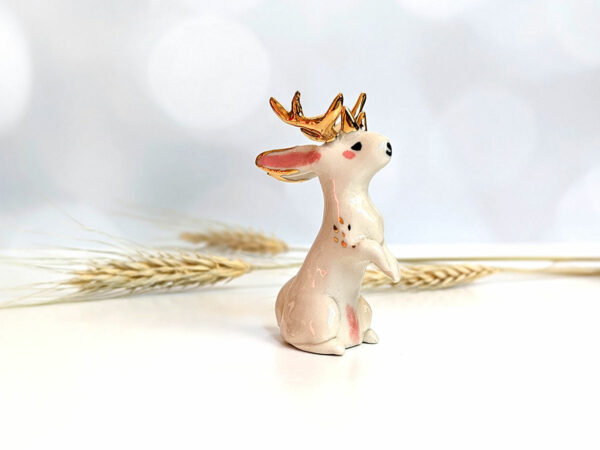 jackalope figurine with golden antlers
