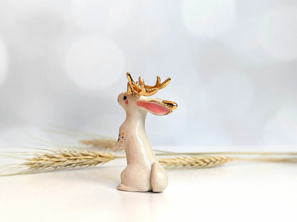 jackalope figurine with golden antlers