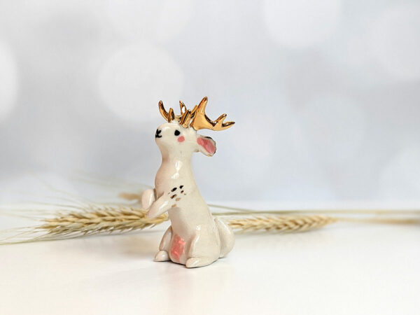 jackalope figurine with golden antlers