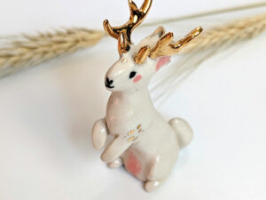 jackalope figurine with golden antlers