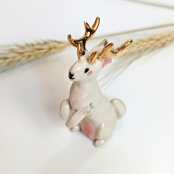 jackalope figurine with golden antlers