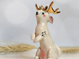 jackalope figurine with golden antlers