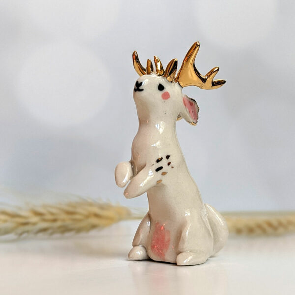 jackalope figurine with golden antlers