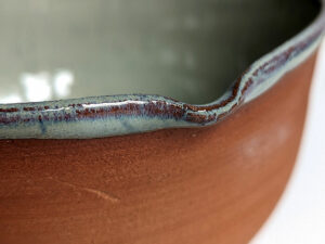 cute otter bowl for matcha in red clay and blue glaze